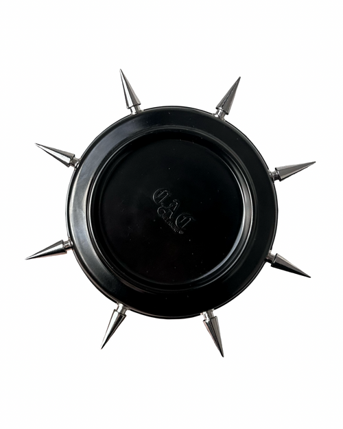 Black spiked ash tray on a white background