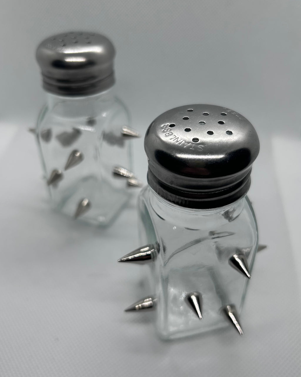 Empty salt and pepper shaker with spikes 