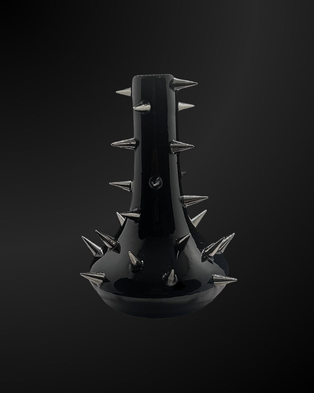 Black spiked vase on a black background